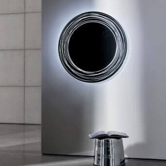 Elegant Sovet Italia Vertigo mirror with special engraving and illuminated white rings creating a halo effect