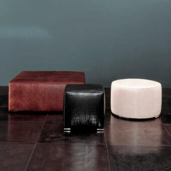 Distinguished Rugiano Form ottoman with reddish-brown textured fabric upholstery and sleek floor-resting design