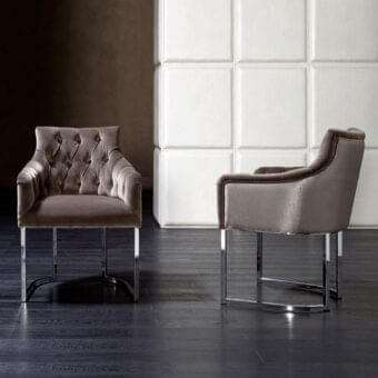 Distinguished Rugiano Itaca armchair with plush fabric upholstery and polished chrome metal base in a muted taupe tone
