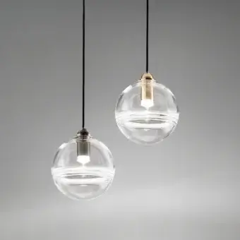 Distinguished Vistosi Oro suspension lamp crafted in crystal glass bisected with a glossy brass-toned internal membrane