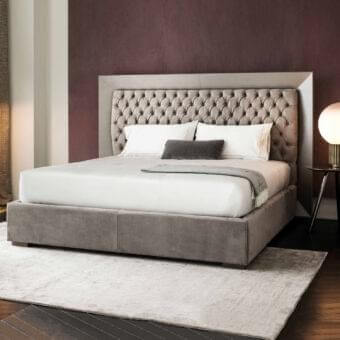 Elegant Rugiano Kenya bed crafted in muted taupe fabric with a deeply button-tufted headboard and silver-toned metallic band
