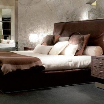 Exceptional Rugiano Riflesso bed with dark brown crocodile-like finish and wave-form stitching on expansive headboard crafted in metal