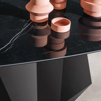 Superior Sovet Italia GranDeod table with dark marbled tempered glass tabletop and matte black geometrically shaped lacquered metal base