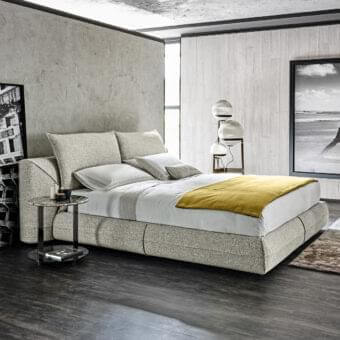 Sophisticated Arketipo Starman Dream bed with neutral gray textile upholstery and matte finish creating a low platform profile