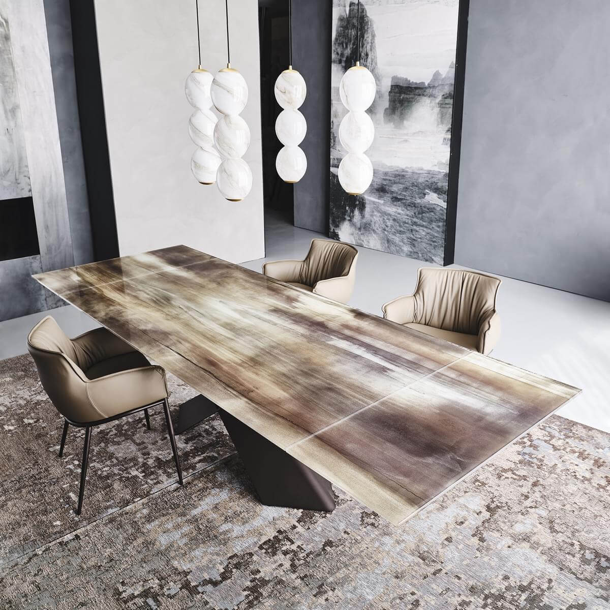 Dining table with marbled brown wood surface and black curved base, surrounded by four beige leather chairs, under white spherical pendant lights.