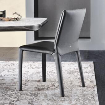 Distinguished Cattelan Italia Penelope chair with dark gray synthetic leather upholstery and gun metal grey piping detail