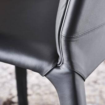 Distinguished Cattelan Italia Penelope chair crafted in soft gunmetal gray leather with a sculpted form and delicate accent line