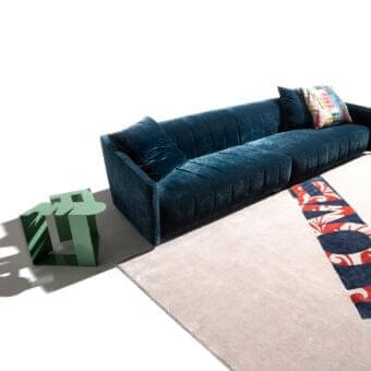 Exceptional Erba Belladonna sofa with cozy shapes and soft paddings upholstered in deep teal textile with refined quilting