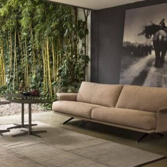 Distinguished Verzelloni Nilson sofa with curved armrests upholstered in light brown textile and a matte finish
