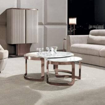 Distinguished DV Home Collection Coco coffee table with rounded form and Calacatta Royal marble top in reflective rose-gold-toned steel base