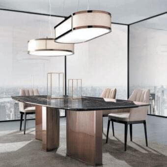 Distinguished DV Home Collection Tiffany table with a refined marble top and bronze-toned stainless steel pedestal legs crafted in Italy