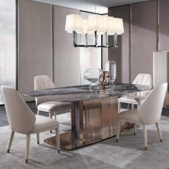 Sophisticated DV Home Collection Windsor table with dark grey and brown marble top and reflective rose-gold stainless steel base