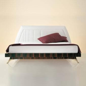Sophisticated OAK Zahira bed with white leather upholstery, Rosewood finish and bronzed brass fittings exhibiting curved lines
