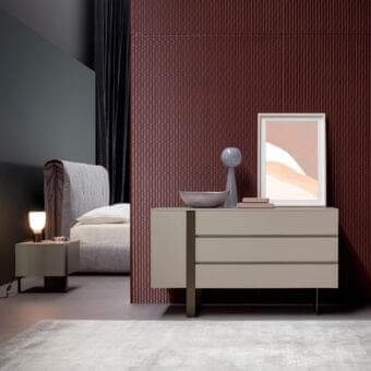 Refined Bonaldo Antibes dresser with light beige lacquered wood and asymmetrical bronze-finished metal base