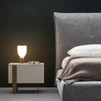 Distinguished Bonaldo Antibes nightstand with neutral lacquered wood and asymmetrical bronze finish metal base