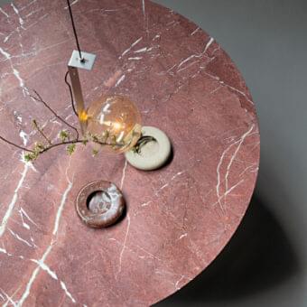 Exceptional Bonaldo Circus table with red ceramic top and white veining, built with a metal base