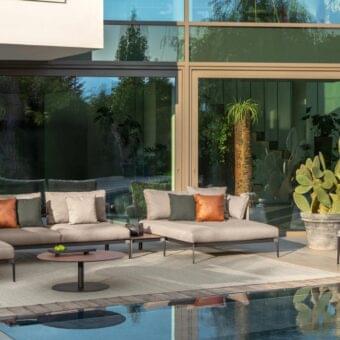Sophisticated Talenti Leaf lounge chair with light grayish-brown weaving in weatherproof fabric and matte finish