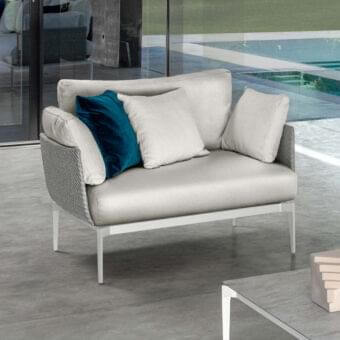 Stylish Talenti Leaf lounge chair with light aluminum structure, light gray weavings and dark blue velvet cushions crafted in Italy