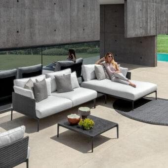 Distinguished Talenti Leaf sectional with light gray cushions and a dark durable aluminum frame crafted in Italy