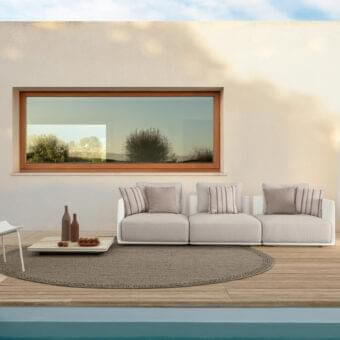 Innovative Talenti Malè sofa with a low polyethylene structure and comfortable cushions in light beige with striped accents