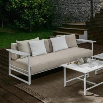 Distinguished Talenti Riviera sofa with elegant lines in light beige and stylish stoneware armrests with matte finish