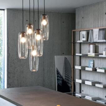 Superior Bonaldo Bio-S suspension lamp with a black metallic frame and transparent blown glass lampshades at varying heights