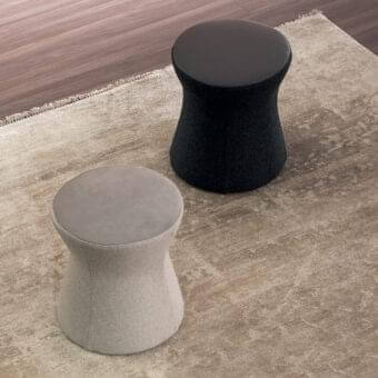 Distinctive Bonaldo Clessidra ottoman with light gray textile upholstery and a smooth darker gray top