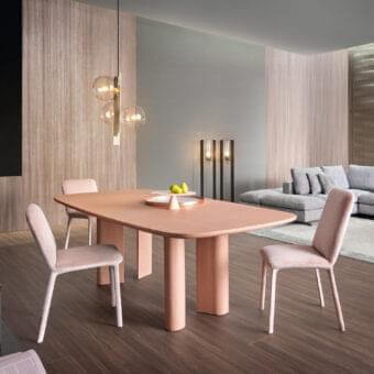 Captivating Bonaldo Geometric table with a rounded rectangular tabletop and cylindrical legs in a light salmon hue with a hand spatulated clay finish