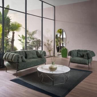 Sophisticated Bonaldo Tirella lounge chair with muted green textured textile and dark metal enveloping cushions