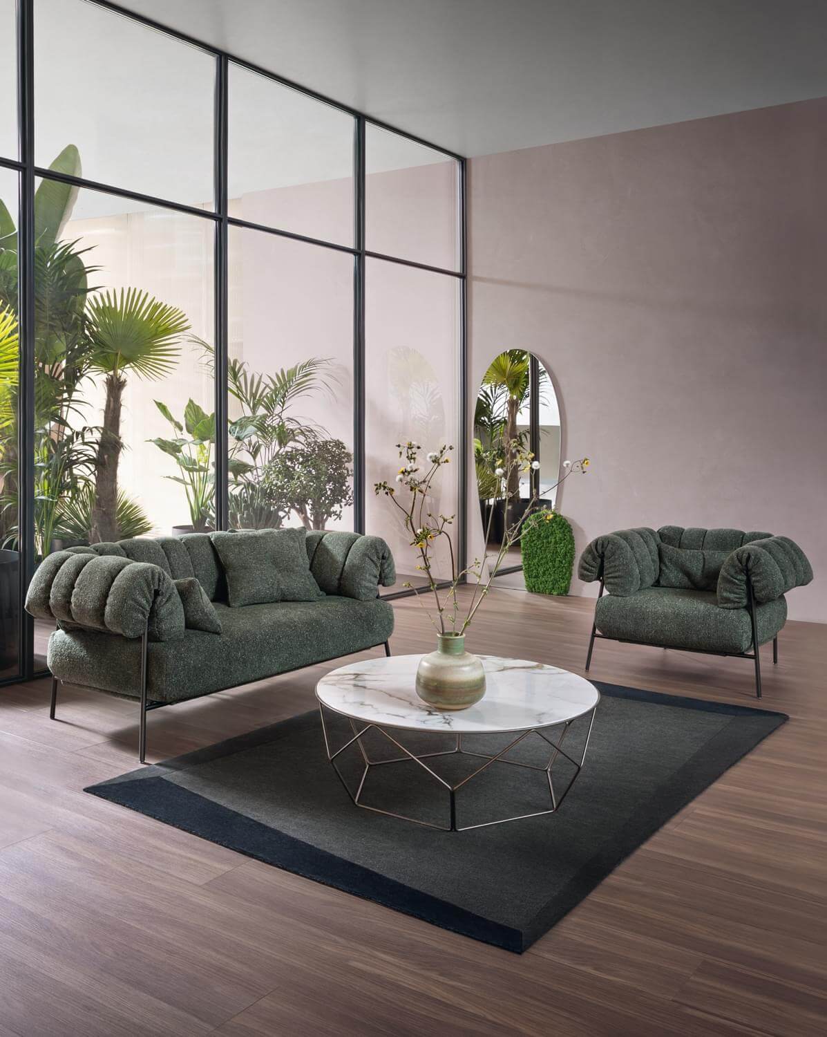 Sophisticated Bonaldo Tirella lounge chair with muted green textured textile and dark metal enveloping cushions