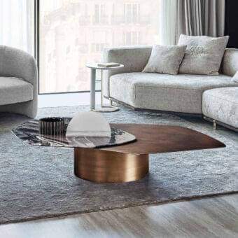 Distinguished Rugiano Incanto coffee table with asymmetrical design in bronzed brass and dark marble-like material with hammered bronze finish