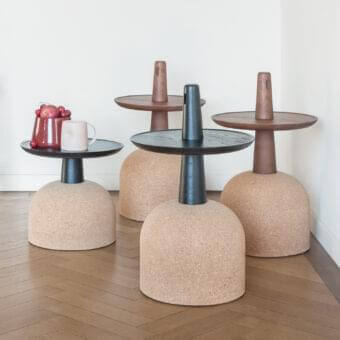 Sophisticated Bonaldo Assemblage side table with a black solid wood top and natural tan cork base