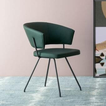 Distinctive Bonaldo Bahia armchair with dark green fabric upholstery and slender outwardly flexing metal legs