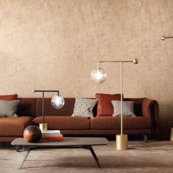 Elegant Bonaldo Bardot floor lamp with geometric metal structure and transparent glass globe in a striking gold finish