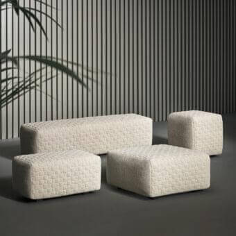 Sophisticated Bonaldo Intrecci ottoman with light woven textile and anthracite grey matt painted wood feet