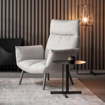 Distinguished Bonaldo Pil Lounge Chair with light neutral gray textile upholstery and dark finished metal base