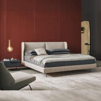 Stylish Bonaldo River bed with woven textile headboard and enveloping side wings, supported by cylindrical metal feet