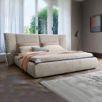Superior Bonaldo Youniverse bed with padded headboard and vertical stitched panels in light beige textured fabric