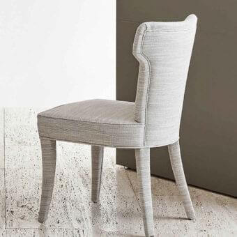 Sophisticated Rugiano Guenda chair with harmonious lines and light gray textile upholstery, crafted in Italy