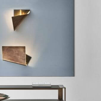 Exclusive Rugiano Leaf Wall Lamp with folded metal, brushed bronze and gold finish emitting a warm glow