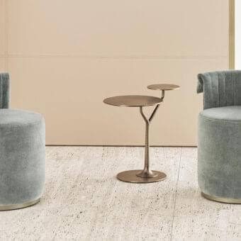 Distinguished Rugiano Manta ottoman with sinuous backrest upholstered in smooth gray textile and bronze plinth base