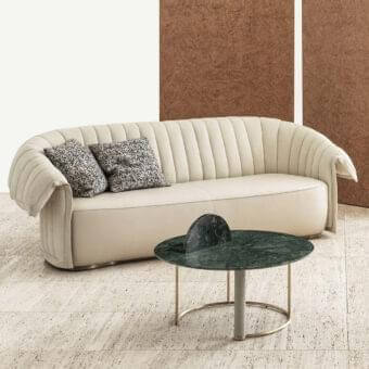Distinguished Rugiano Manta sofa with light beige textile upholstery, smooth finish and patterned cushions enriched with vertical stitchings