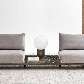 Elegant Rugiano Memphis sofa with woven armrests braided in velvet rope and grey textile cushions with a bronze tone metal base and dark marble table