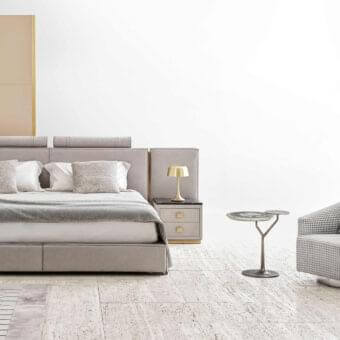 Lavish Rugiano Rubik bed crafted in light gray fabric with golden metal details offering a contemporary aesthetic