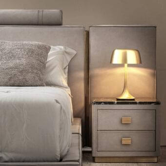 Exclusive Rugiano Rubik nightstand upholstered in light grey leather with a luxury marble top and gold-toned brass details, exhibiting a smooth matte finish