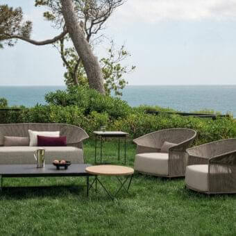 Distinguished Potocco Ola sofa with woven light brown “Fly” ribbon and plush light beige cushions paired with accent pillows