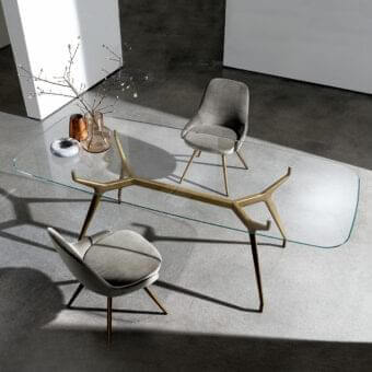 Superior Sovet Italia Arkos table with rounded glass top and satin golden die-cast aluminum X base