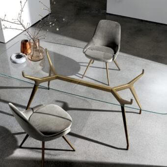 Exceptional Sovet Italia Arkos table with a refined glass top and textured matte bronze die-cast aluminum legs