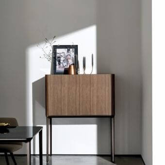 Distinguished Sovet Italia Madia Slim cupboard crafted in Canaletto walnut veneered mdf with an aluminum base finished in medium-toned brown