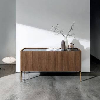 Distinguished Sovet Italia Madia Slim sideboard with veneered Canaletto walnut and ceramic top, built with a brass finished aluminum base